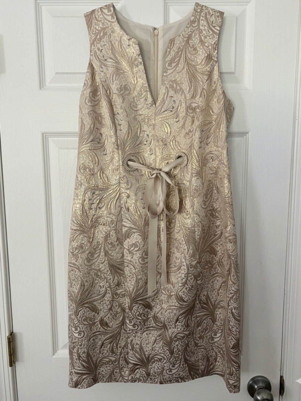 Gold brocade cocktail dress with pretty rhinestones detail. Size 4.